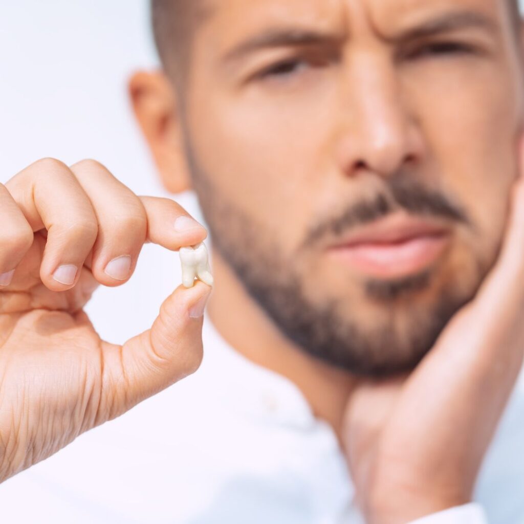 Dentist examining painful wisdom tooth for possible removal