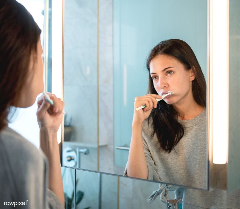 Dentist explaining complete oral care routine including flossing mouthwash and dental cleaning