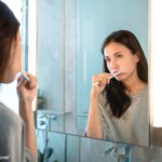Dentist explaining complete oral care routine including flossing mouthwash and dental cleaning