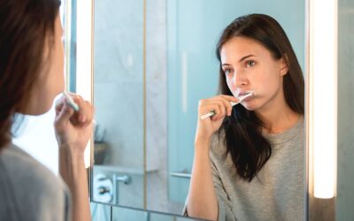 Dentist explaining complete oral care routine including flossing mouthwash and dental cleaning
